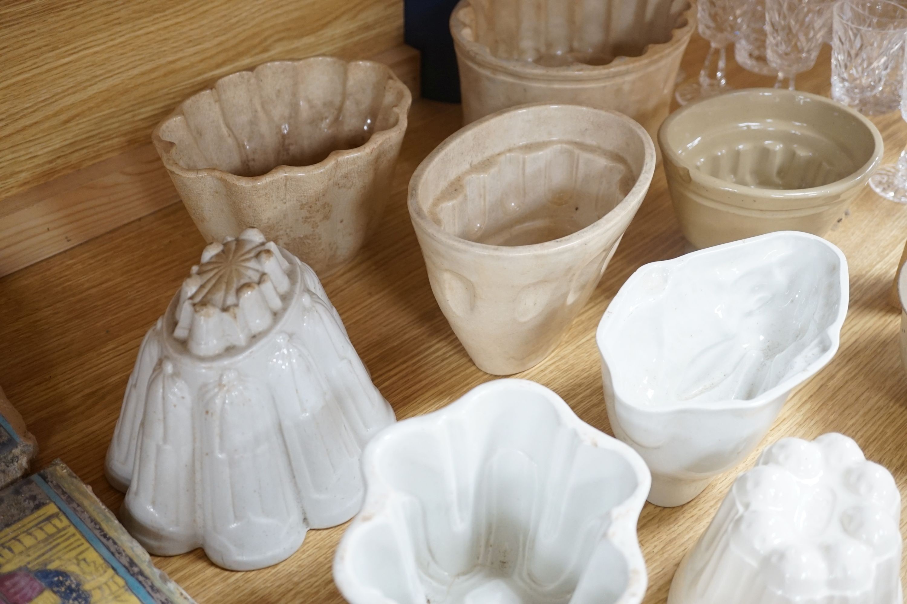 A collection of thirteen various sized 19th and 20th century ceramic jelly moulds